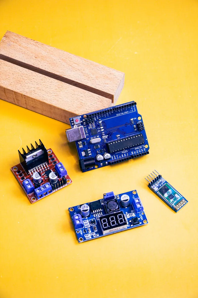 Arduino and sensor prototyping boards on a wooden block