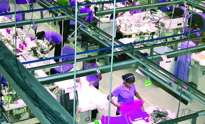 Garment factory floor with sewing stations where RFID sensors are deployed