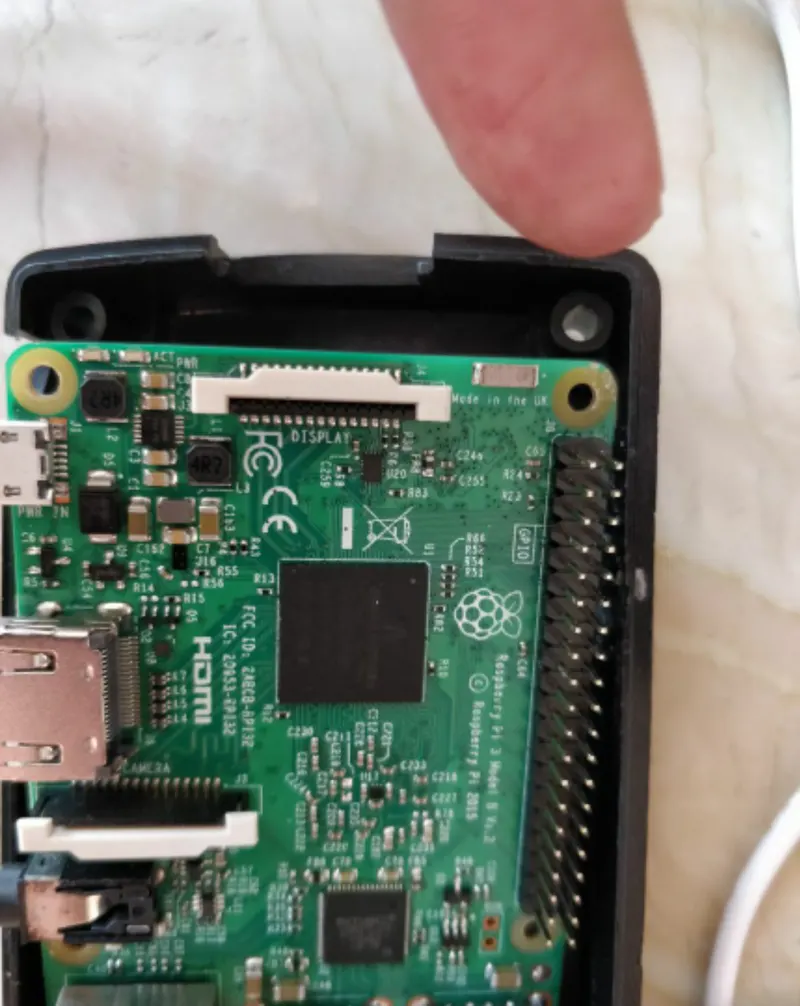 Fleet of Raspberry Pi boards in black cases prepared for retail store deployment