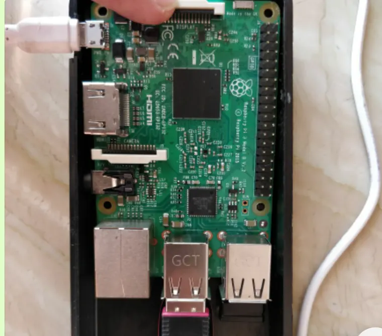 Raspberry Pi case connected to a 5 volt ERD power adapter